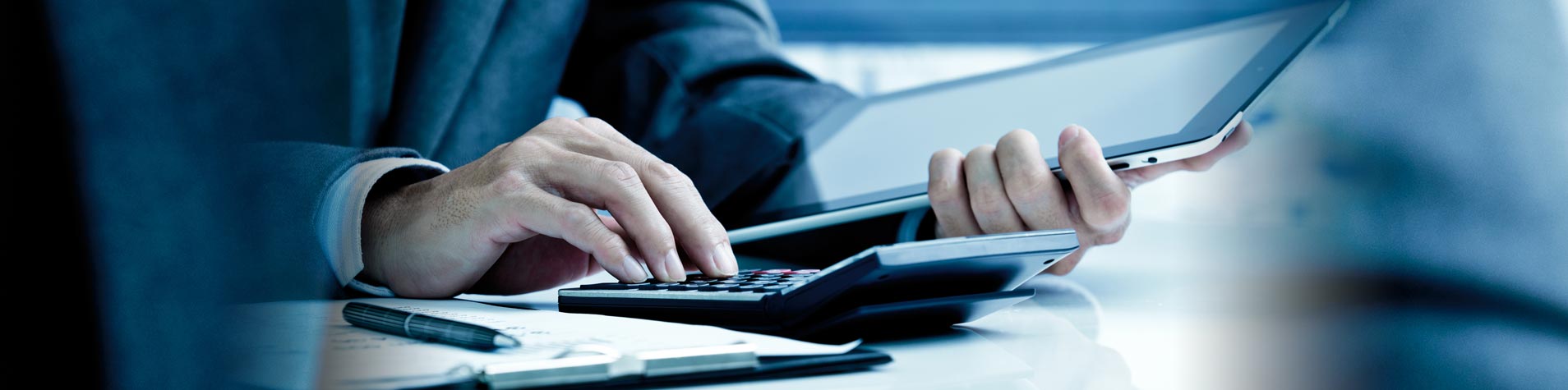 Man working on calculator